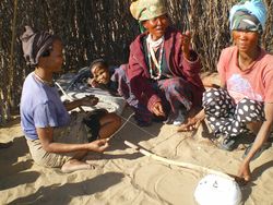 Women playing tandiri [dakateri] musical bow