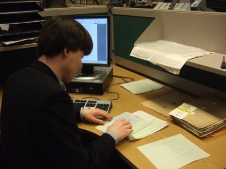 Cataloguer working on the collection